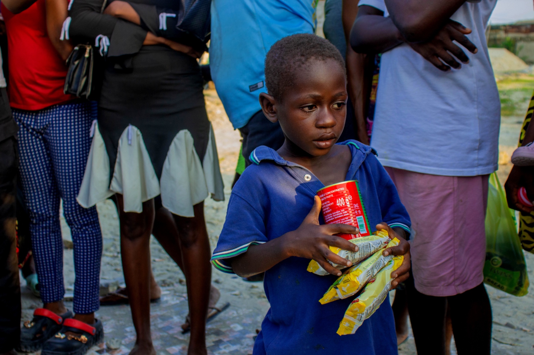 A child receiving relief supplies